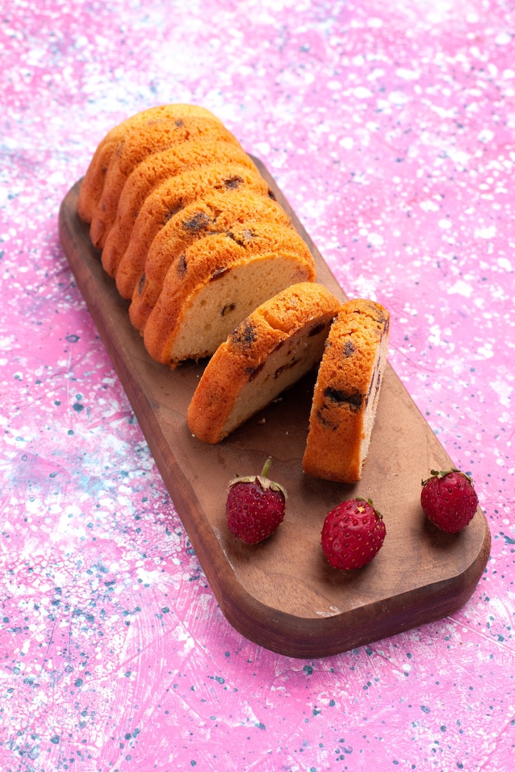 Free Photo front view delicious cake sweet and yummy sliced on pink desk.