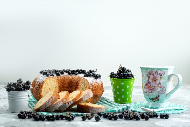 A front view delicious cake with fresh blueberries and tea on the white desk cake biscuit tea berry sugar