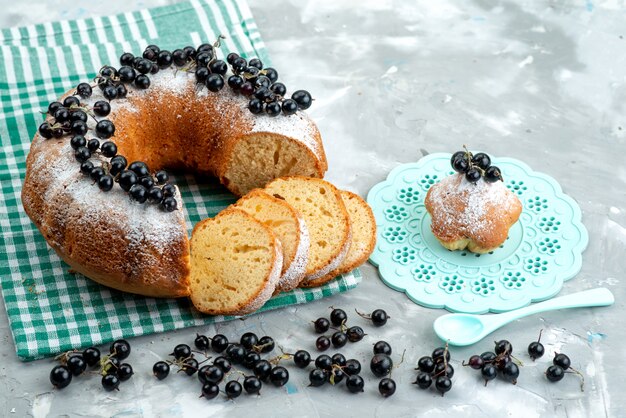 A front view delicious cake with fresh blueberries on the white desk cake biscuit tea berry sugar