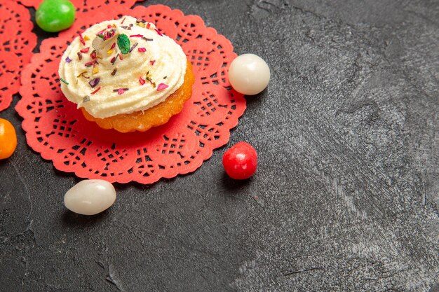 Front view delicious cream cakes dessert for tea with candies on grey background cake cream biscuit sweet cookie dessert