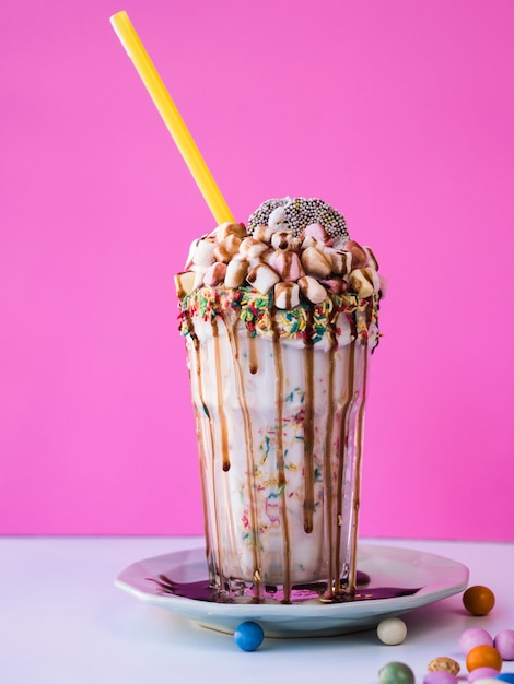 Front view of delicious milkshake on a plate