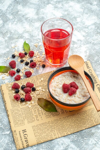 Front view delicious porridge with raspberries on light table