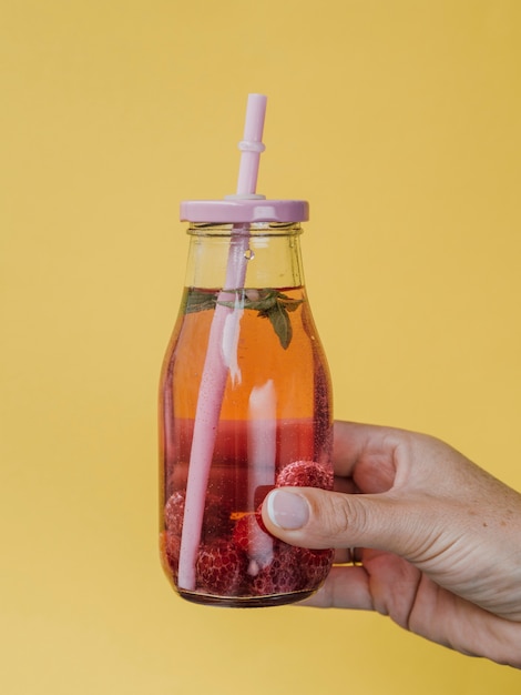 Free photo front view of delicious raspberry natural juice with straw