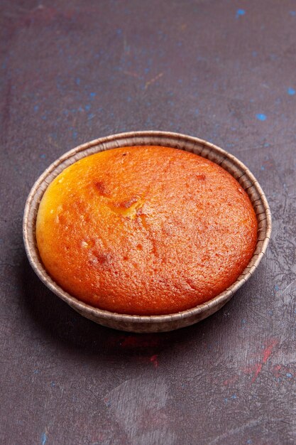 Front view delicious round pie sweet bake on dark background biscuit dough pie cake sugar sweet