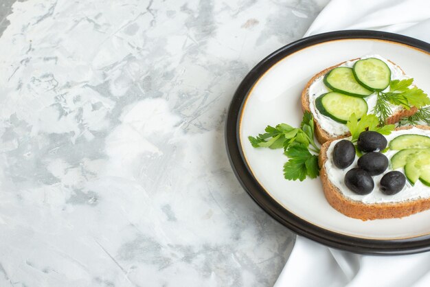 Front view delicious sandwiches with cucumbers and olives inside plate white background health horizontal lunch toast meal burger food bread