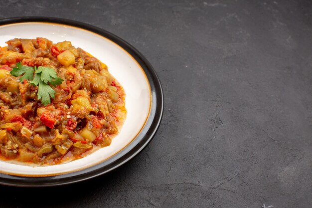 Front view delicious vegetable meal sliced cooked dish inside plate on a grey background meal food sauce soup dinner vegetable