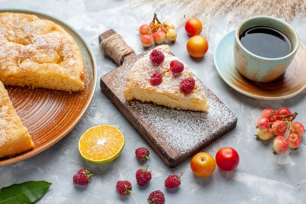 Front view delicious yummy pie with fresh fruits and tea on the white desk sugar sweet pie cake biscuit