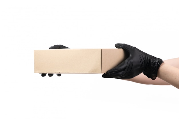 A front view delivery box hold by female in black gloves on white