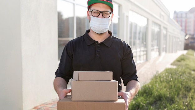 Free photo front view of delivery man concept
