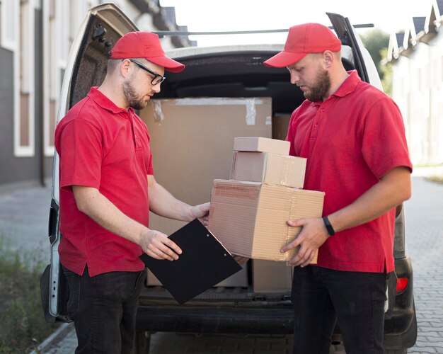 Front view of delivery man with packagaes