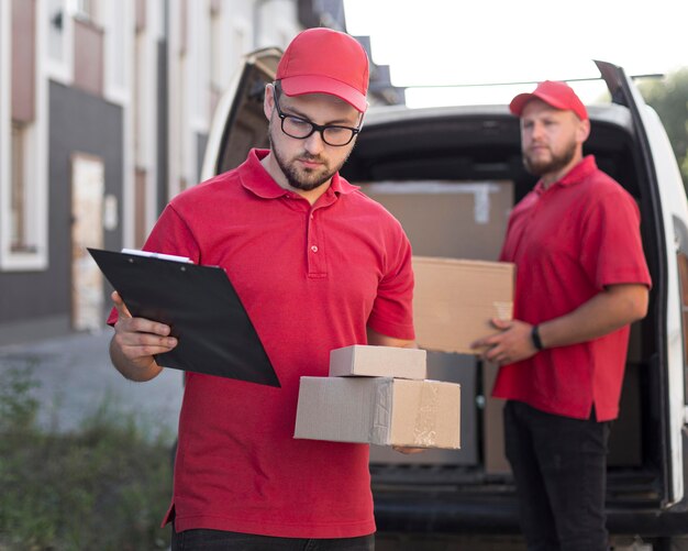 Front view of delivery man with packagaes