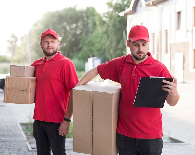 Front view of delivery man with packagaes