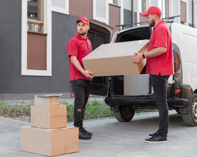 Free photo front view of delivery men at job concept