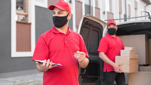 Front view of delivery men with mask