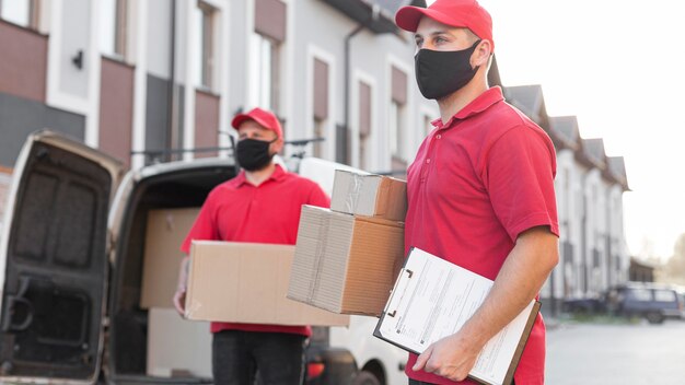 Front view of delivery men with mask