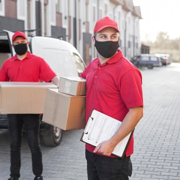 Front view of delivery men with mask