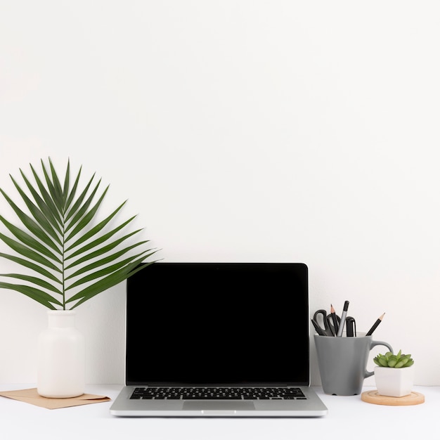 Free photo front view of desk concept with copy space