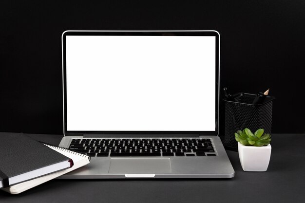 Front view of desk dark concept with copy space