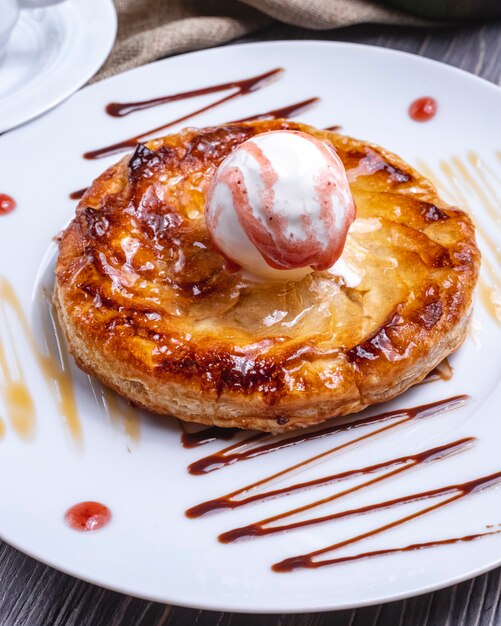 Front view dessert with ice cream on a plate with icing