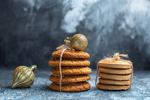 Front view different delicious biscuits on the light background