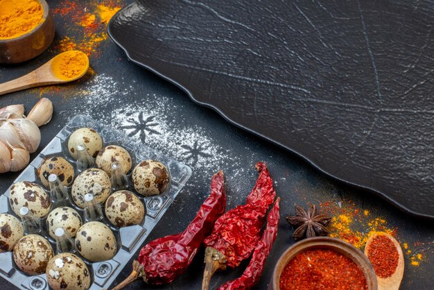 Front view different ingredients eggs flour raw pasta and seasonings on dark background vegetable color dark dough bird salad egg