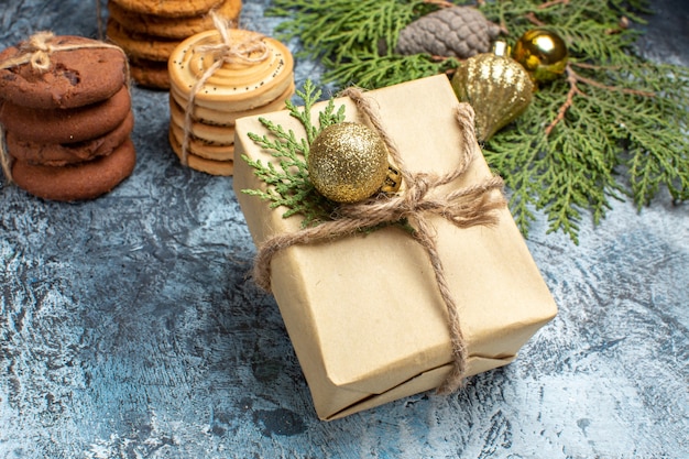 Front view different sweet biscuits with present on light background