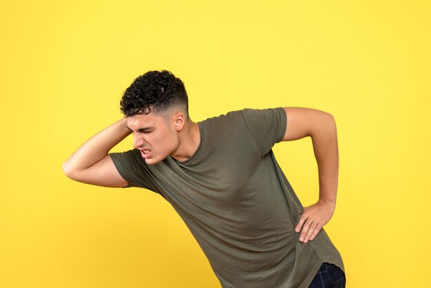 Front view of disgruntled man bent over because his neck hurts