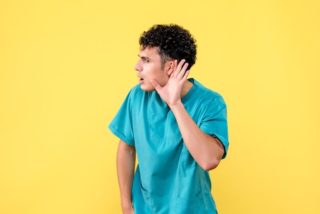 Front view doctor a doctor listens to the problems of his patients