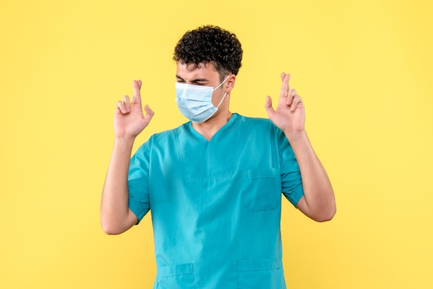 Front view doctor the doctor in mask hopes that health status of patients have improved