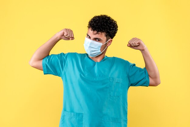 Front view doctor the doctor in mask talks people that it is importante to wash hand