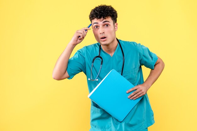 Front view doctor the doctor with folder with documents is thinking about his patients