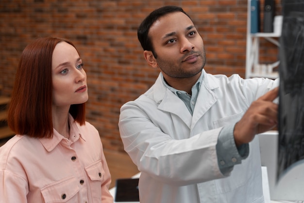 Front view doctor holding radiography