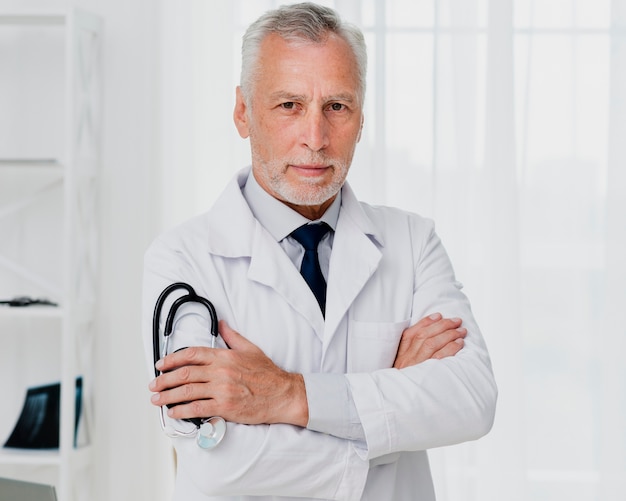 Front view of doctor holding stethoscope