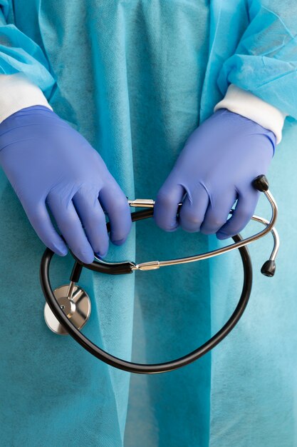 Front view doctor holding stethoscope