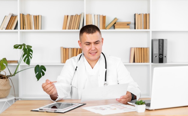 Front view doctor looking on a recipe