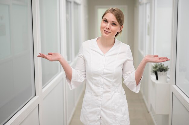 Front view doctor posing indoors