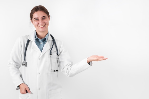 Free photo front view doctor smiling with copy space