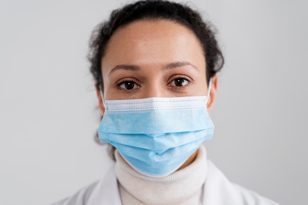 Front view doctor wearing face mask