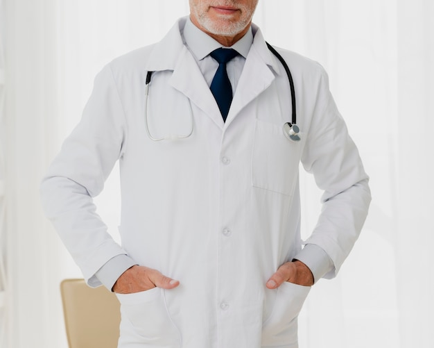 Front view of doctor with hands in pocket