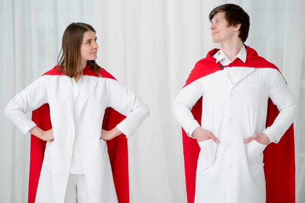 Front view doctors posing with coats