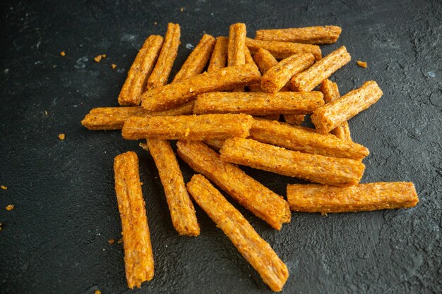 Front view dried rusks on dark bread color photo snack cips