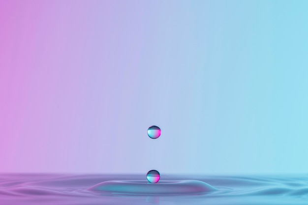 Free photo front view of drop in clear liquid with copy space