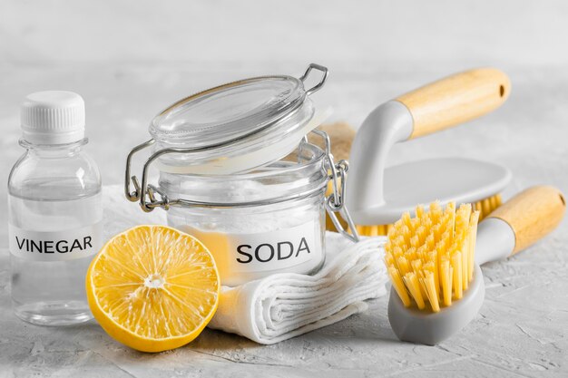 Front view of eco-friendly cleaning brushes with lemon and baking soda