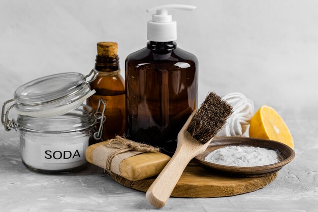 Front view of eco-friendly cleaning products with soap and brush