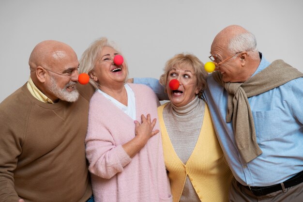 Front view elder friends partying together