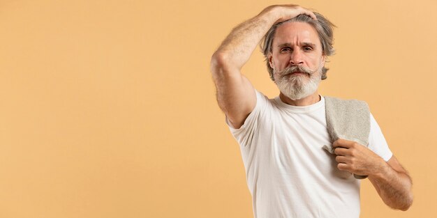 Front view of elder man with beard and copy space