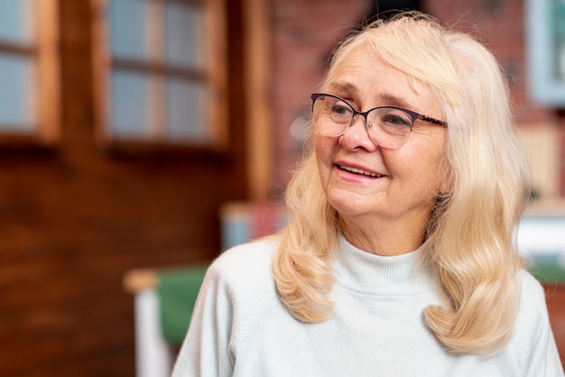 Front view elder woman with glasses