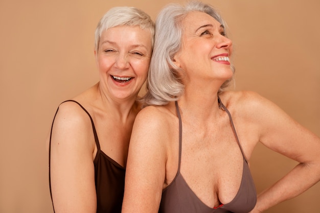 front view eldery women in swimsuits posing