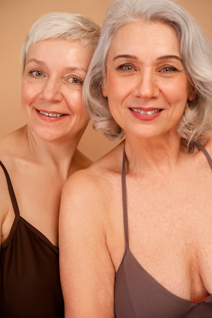 front view eldery women in swimsuits posing