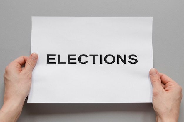 Front view of elections concept with hands